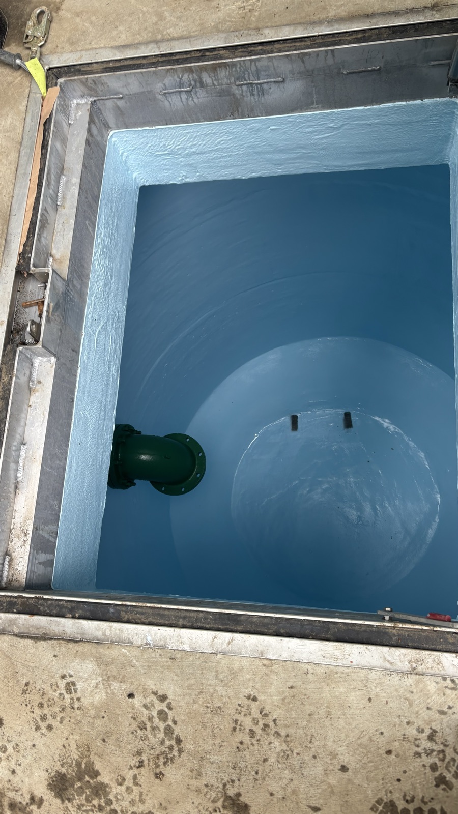 Coated concrete access vault detail